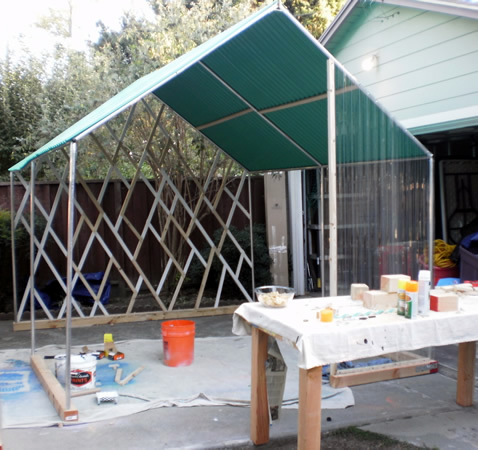 Pilar Aguero-Esparza and H. Dio Mendoza. Construction of temporary home out of recycled materials for ZER01 at the Mariachi Festival.