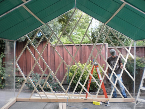 Pilar Aguero-Esparza and H. Dio Mendoza. Construction of temporary home out of recycled materials for ZER01 at the Mariachi Festival.